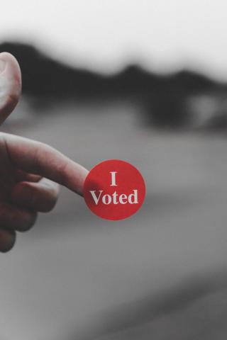 Image of a red sticker reading "I Voted"